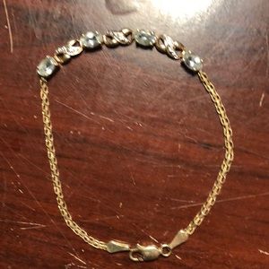 14 carat gold bracelet with blue stones